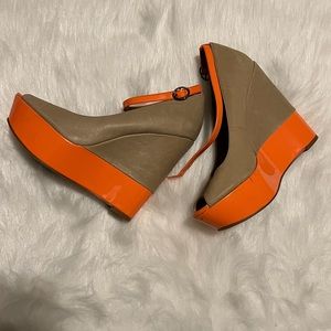 Nude and Coral/Orange Wedge. Brand new with defects. Size 8